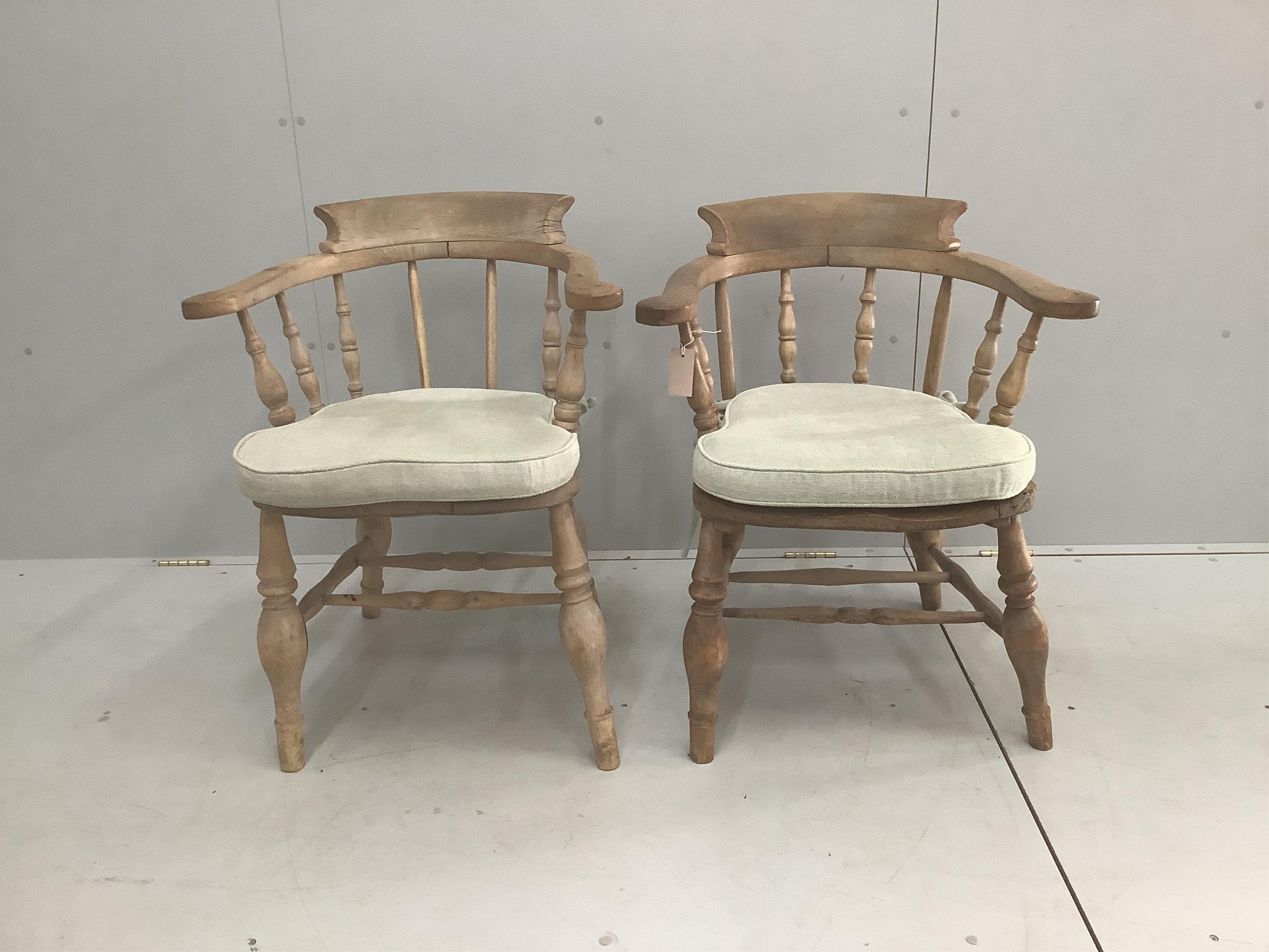 Two Victorian bleached elm and beech smoker’s bow chairs, larger width 64cm, depth 48cm, height 80cm. Condition - good